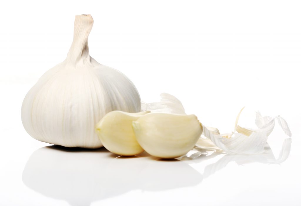 Close up of fresh garlic over white background